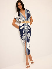 Dress with deep V-neck and tropical print, front view with belt