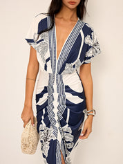 Dress with deep V-neck and tropical print, side profile