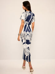 Dress with deep V-neck and tropical print, back view
