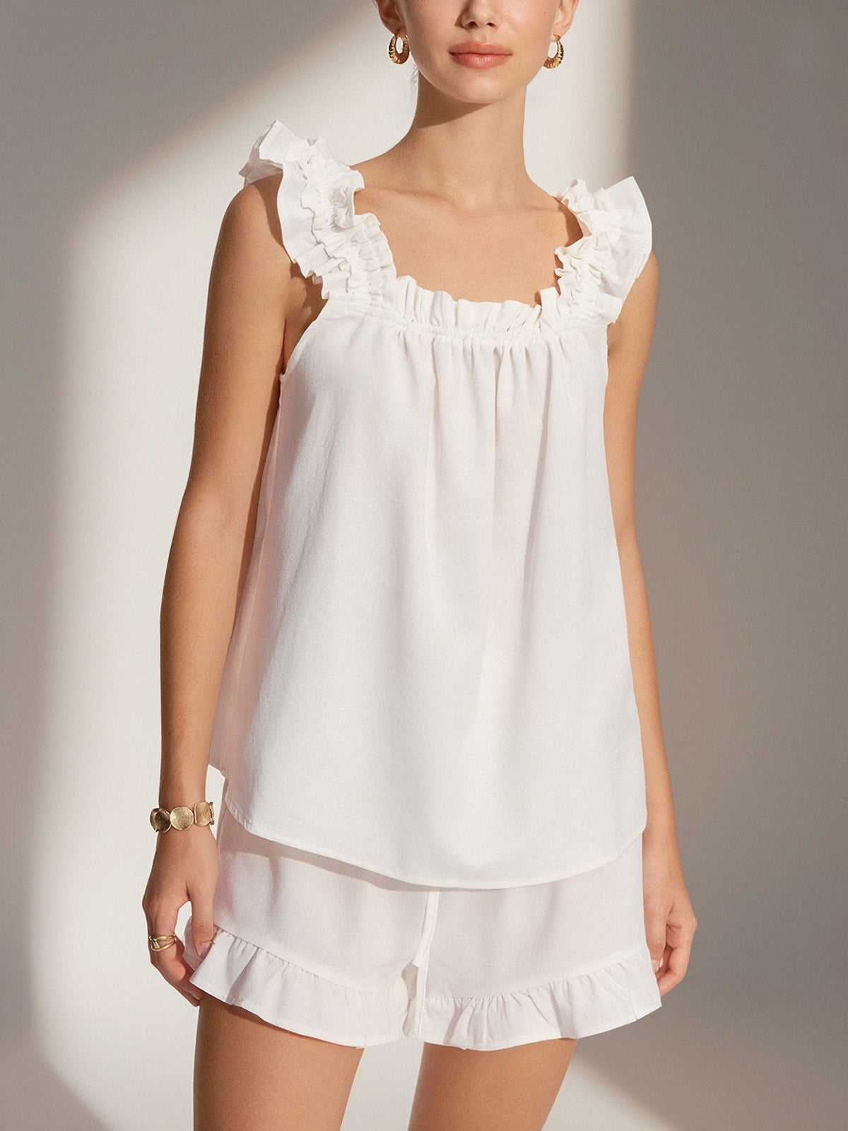 White loungewear set with ruffle details front view