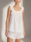 White loungewear set with ruffle details front view