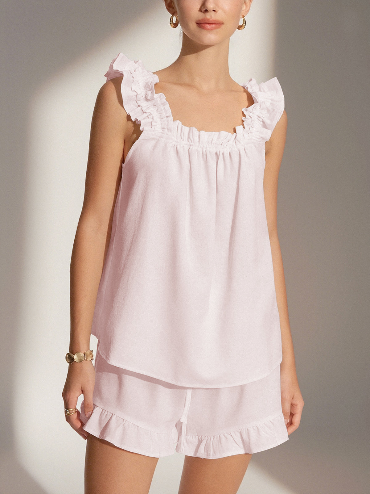 Pink loungewear set with ruffle details front view