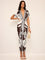 Dress with deep V-neck and tropical print, front view in brown and white