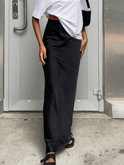 Black satin maxi skirt with flared hem full-length view