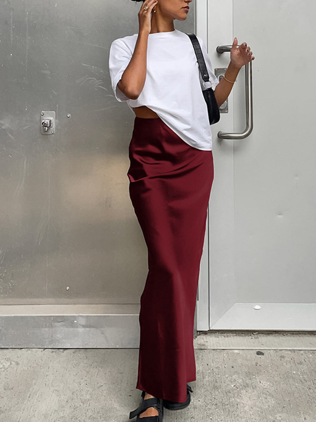 Red satin maxi skirt with flared hem front view