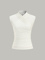 White sleeveless top with ruched detail isolated front view