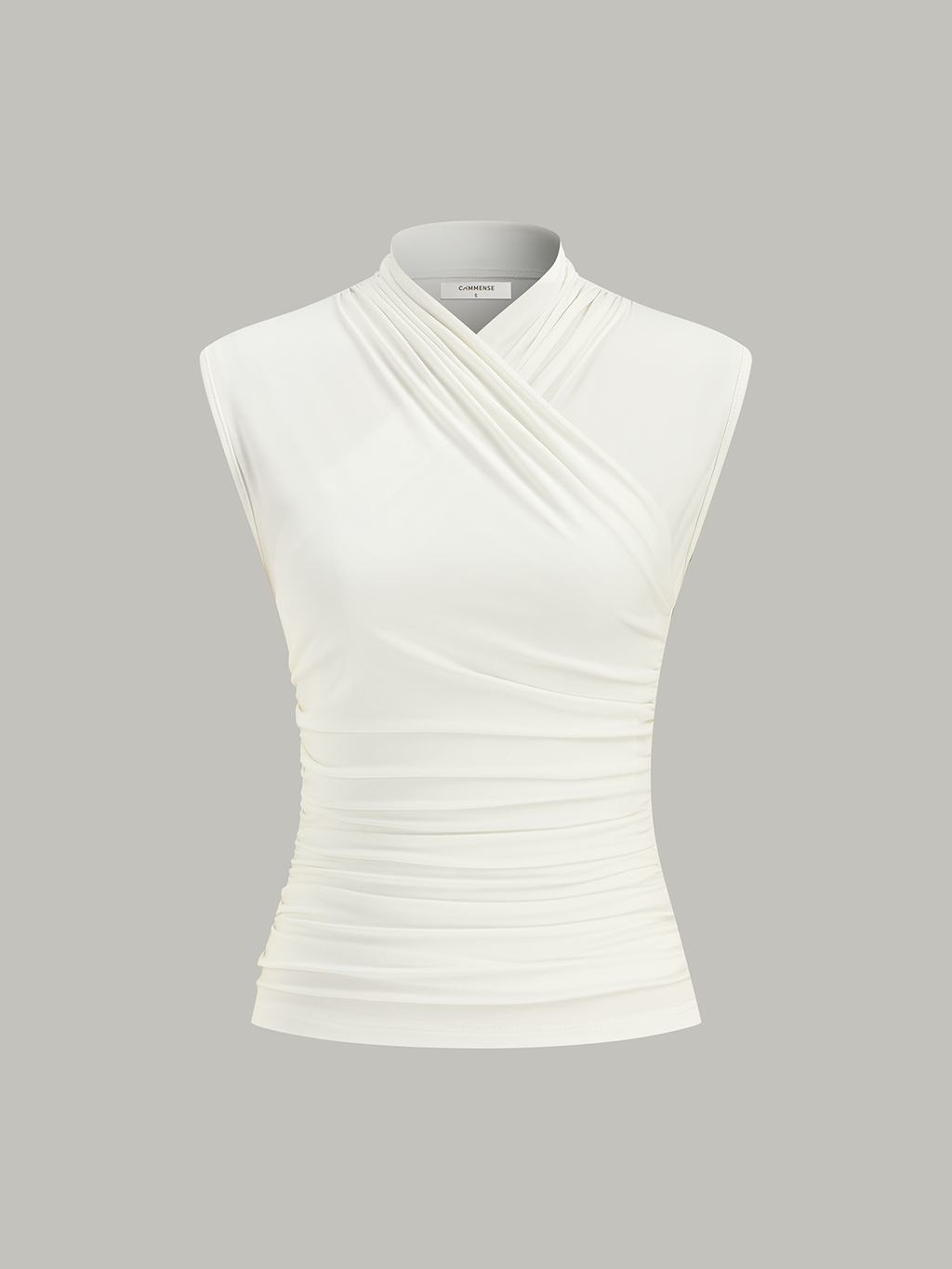 White sleeveless top with ruched detail isolated front view