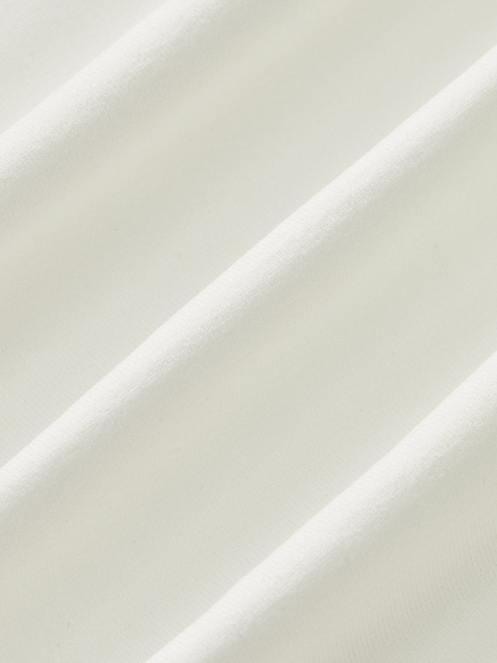 Close-up of white sleeveless top fabric texture
