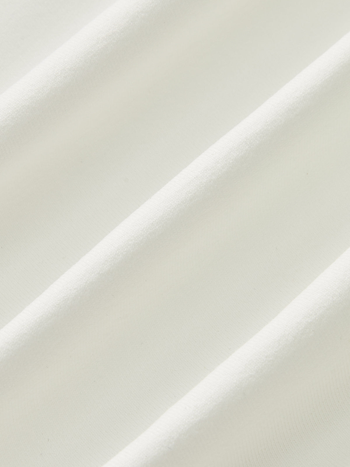 Close-up of white sleeveless top fabric texture