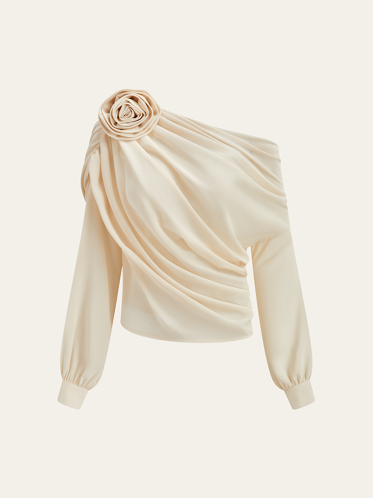 Blouse with off-shoulder design and floral accent, studio shot