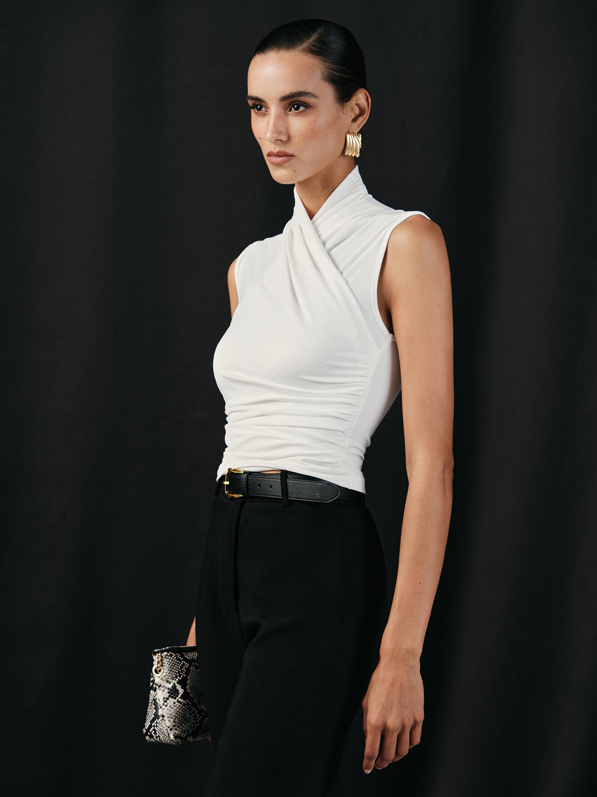 White sleeveless top with ruched detail three-quarter view