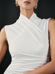 Close-up of white sleeveless top with ruched neckline