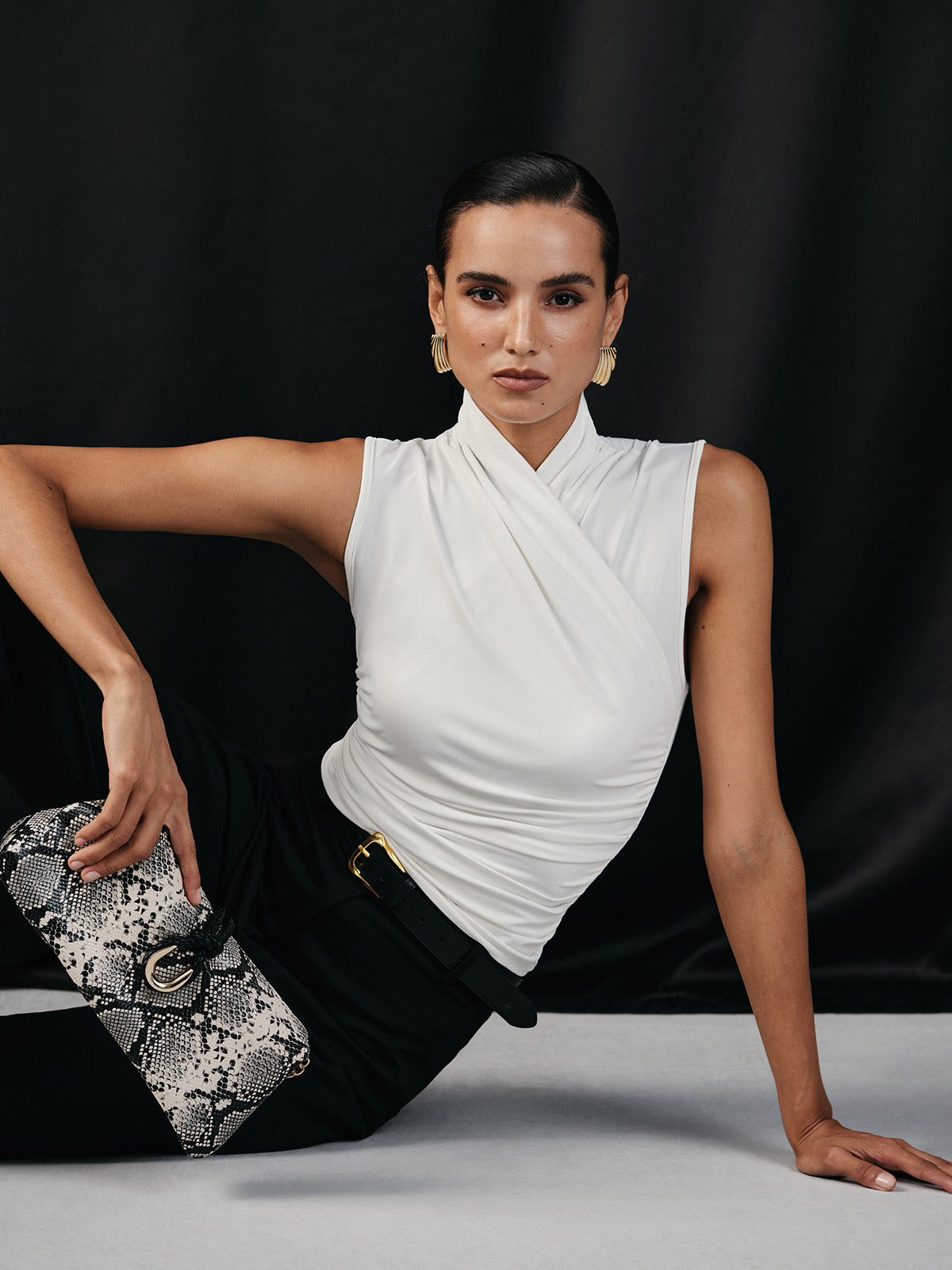 White sleeveless top with ruched detail front view