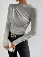 Gray top with ruched draping three-quarter view