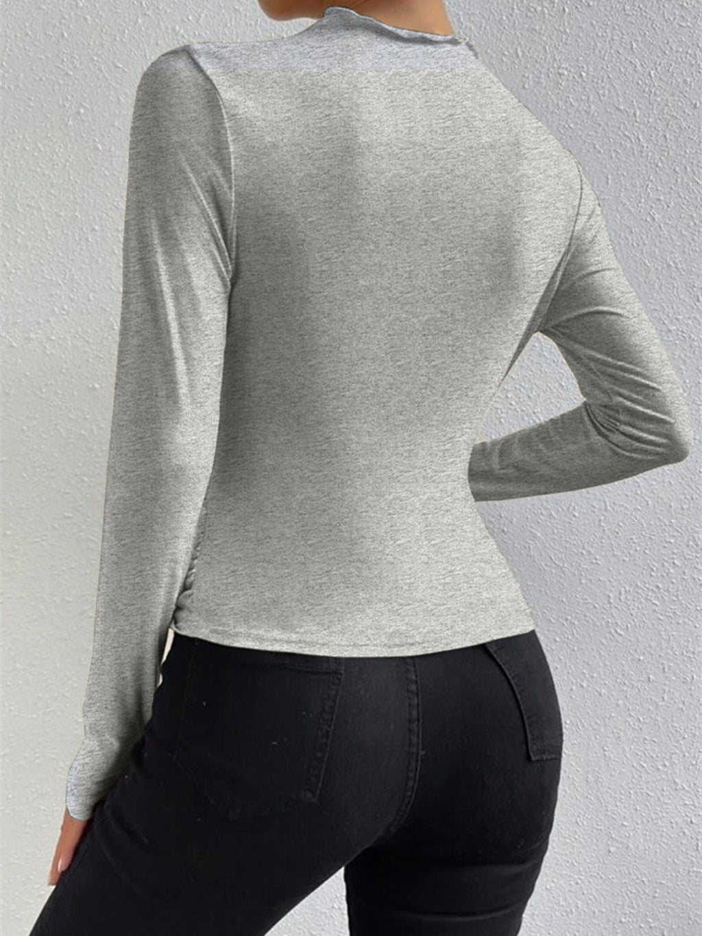 Gray top with ruched draping back view