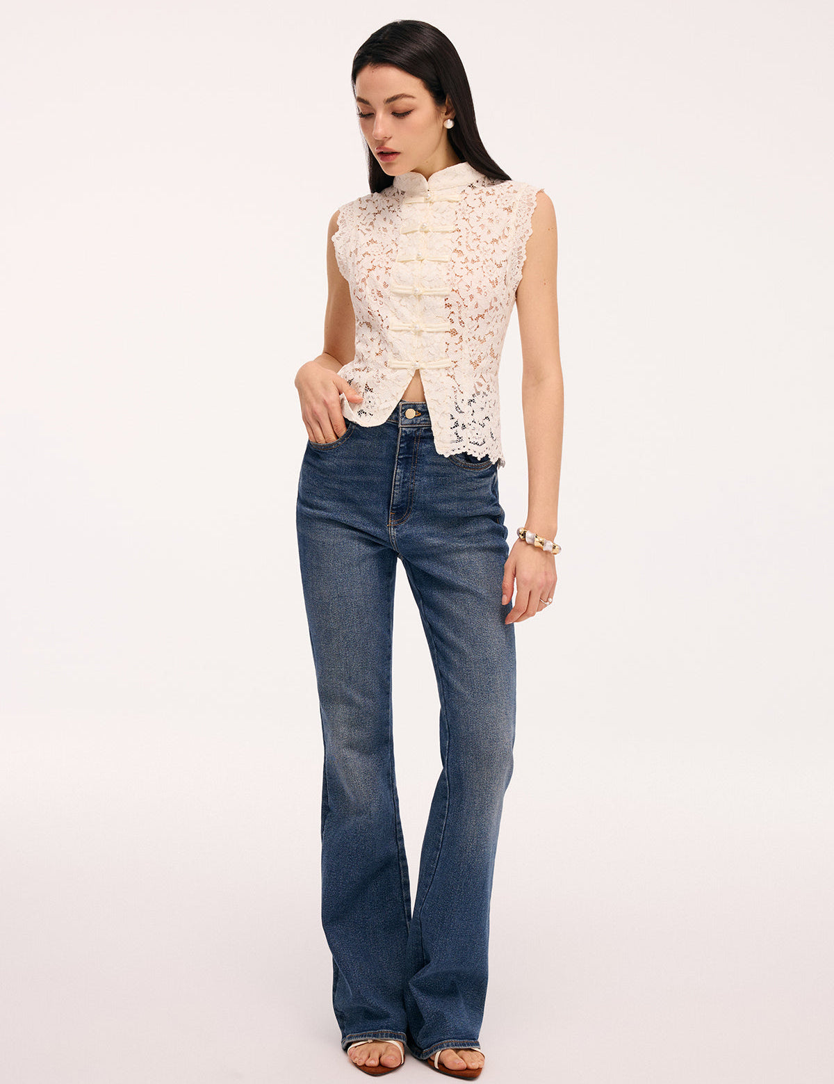 Cream lace blouse with pearl buttons side profile