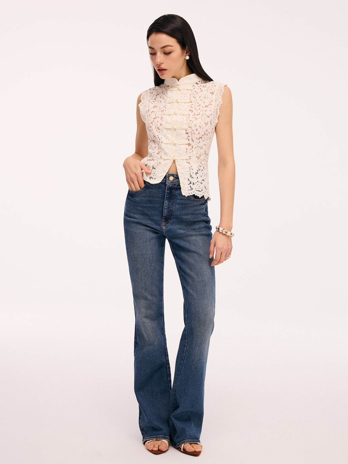 Cream lace blouse with pearl buttons side profile