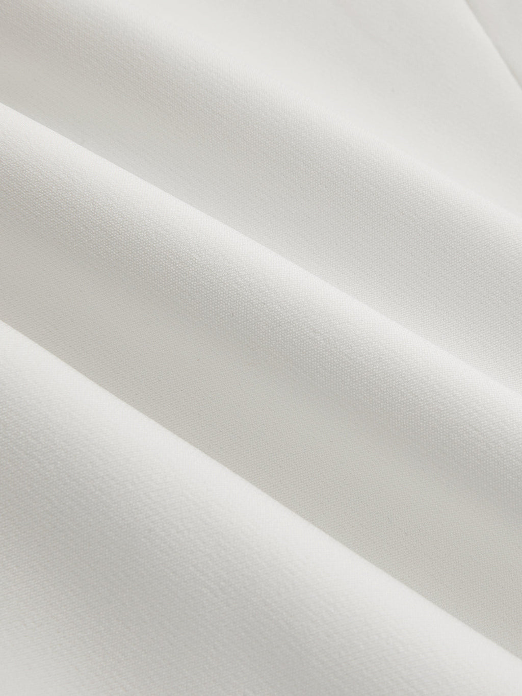 White V-neck top fabric texture, close-up