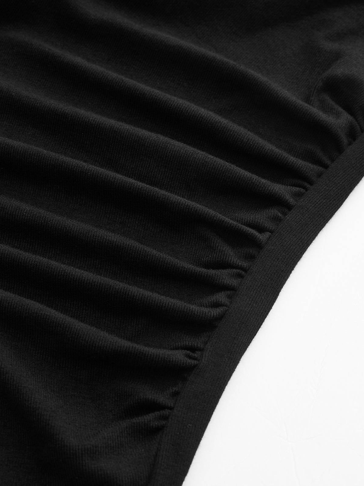 Black asymmetrical neck top with ruched detail close-up of ruched texture