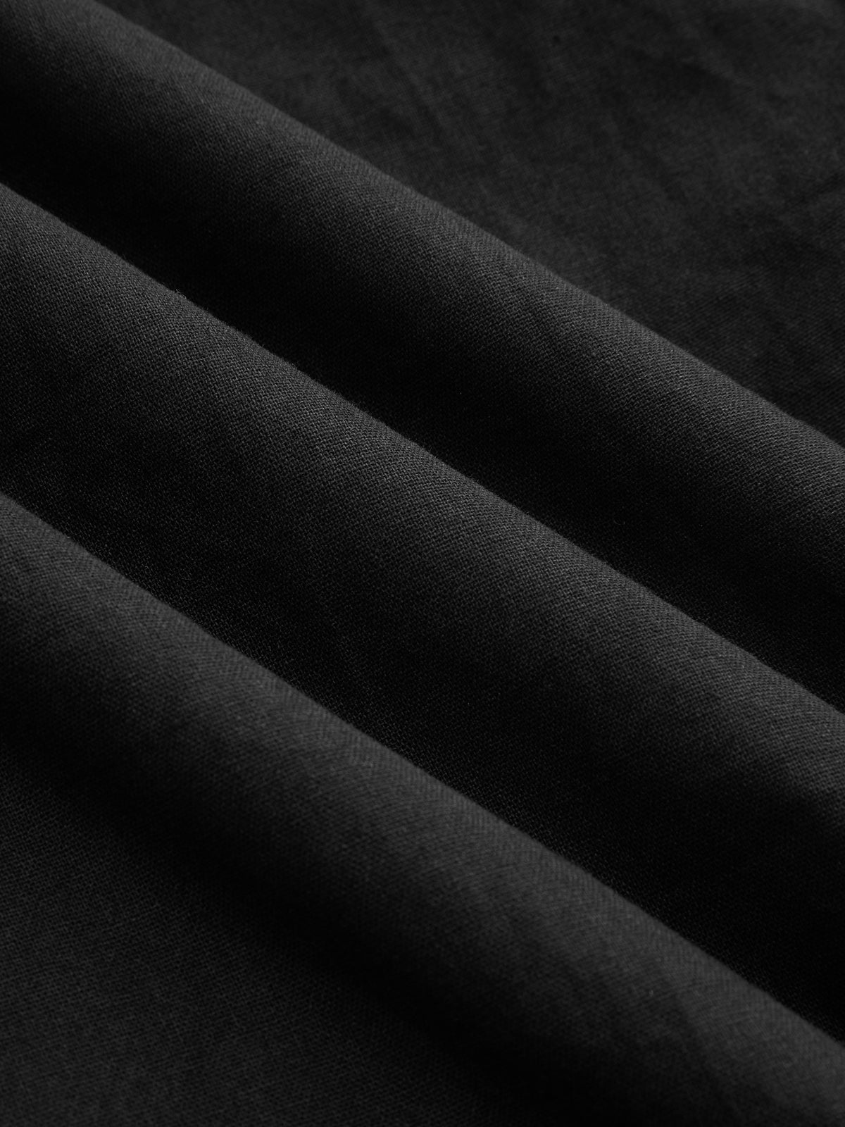 Black maxi dress fabric texture close-up