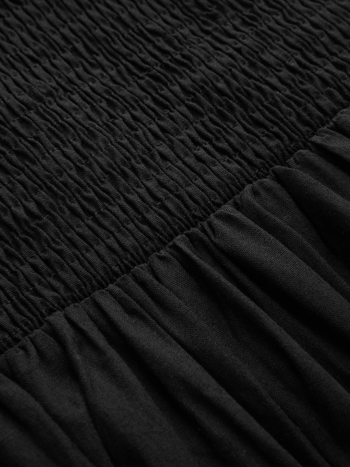 Black maxi dress shirred waist detail close-up