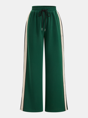 Green joggers with white and black stripes front view isolated