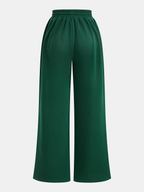 Green joggers plain front view isolated
