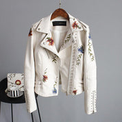 White leather jacket with floral embroidery and studs, front view