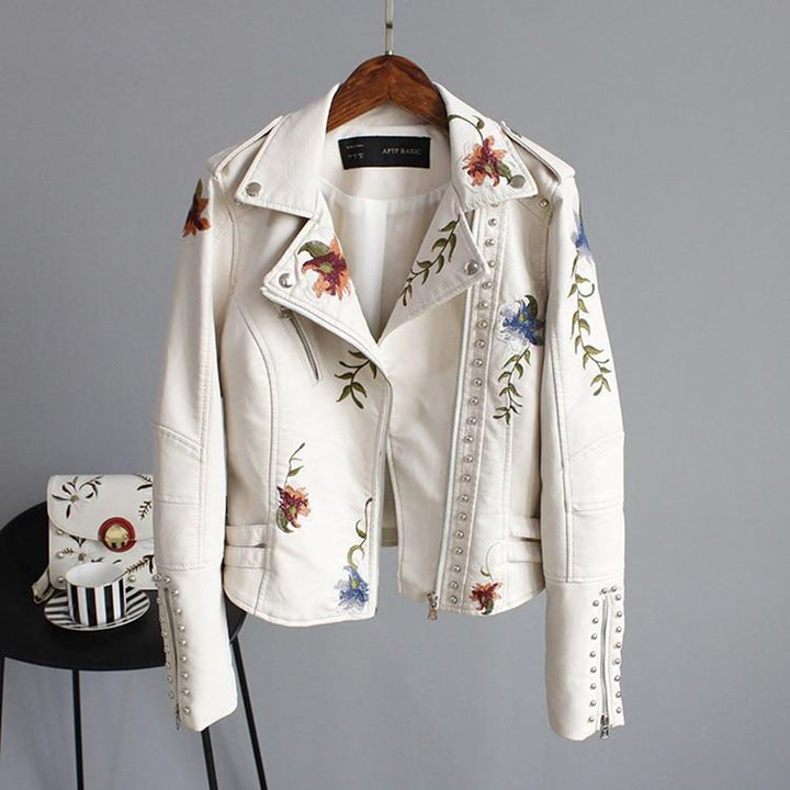White leather jacket with floral embroidery and studs, front view
