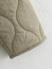 Jas beige gestikt detail schouder