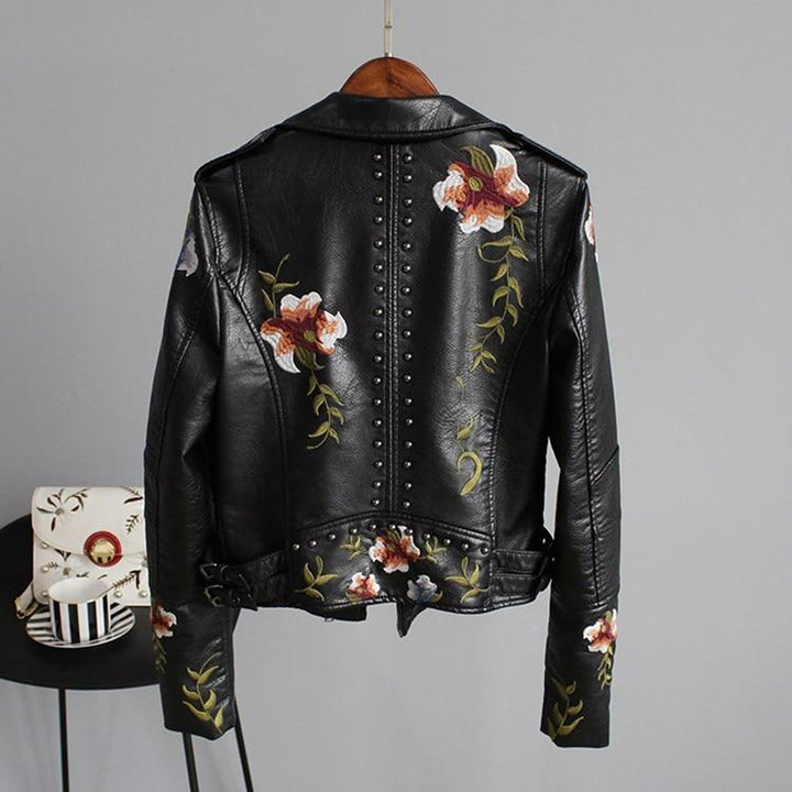 Black leather jacket with floral embroidery and studs, back view