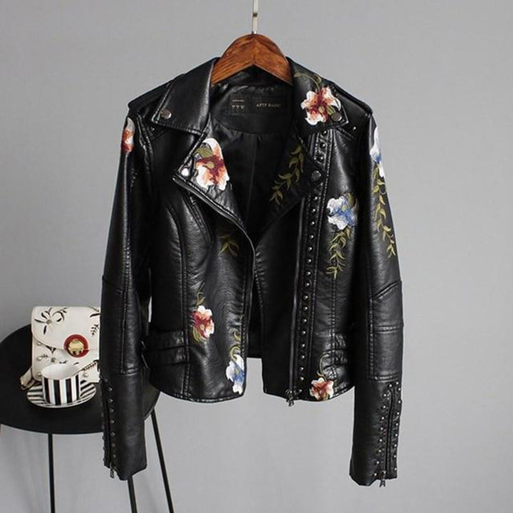 Black leather jacket with floral embroidery and studs, front view