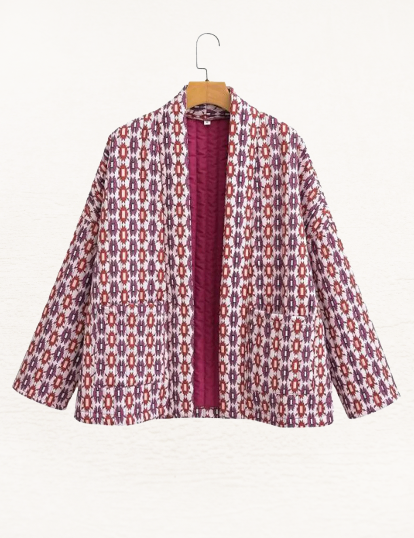 Women's jacket with red and white pattern, hanging front view