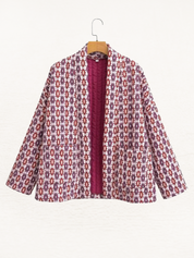Women's jacket with red and white pattern, hanging front view