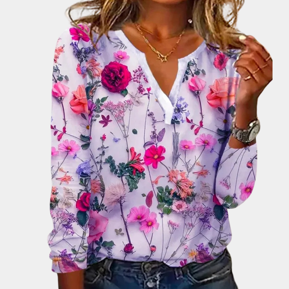 Blouse with detailed floral print, light purple background, front view