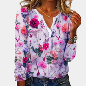Blouse with detailed floral print, light purple background, front view