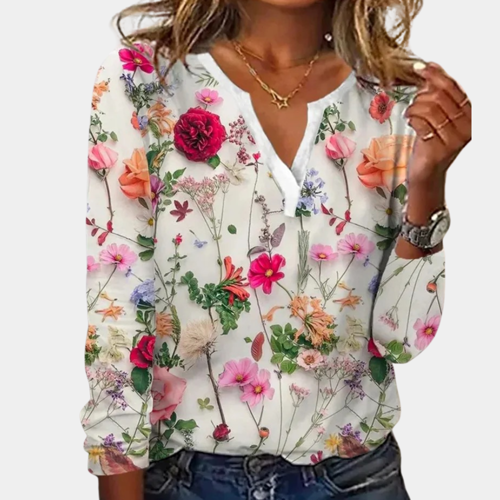 Blouse with colorful floral print, white background, front view