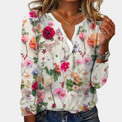 Blouse with colorful floral print, white background, front view