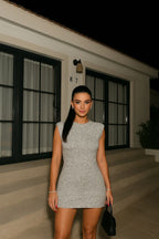 Gray mini dress with shoulder pads front view