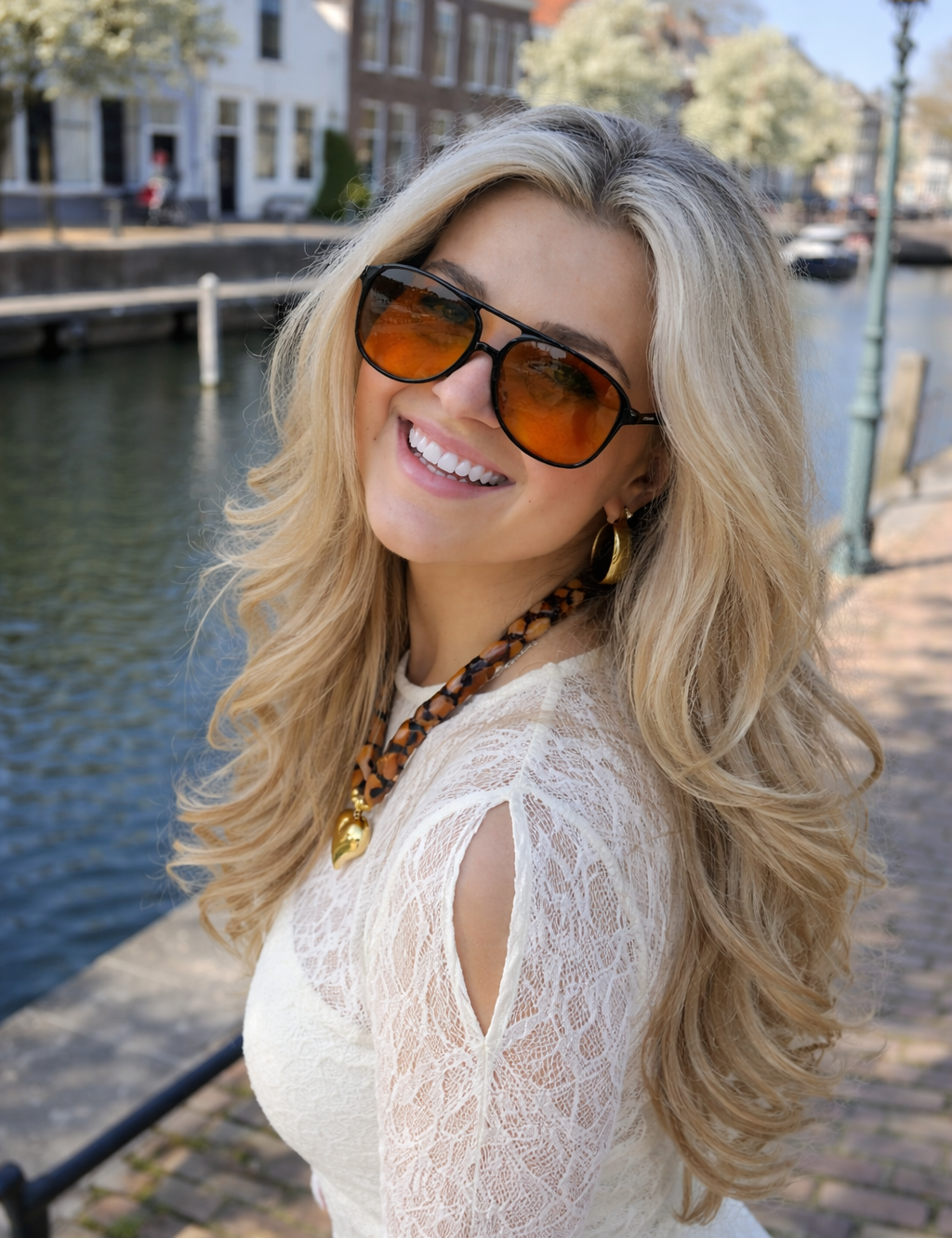 Model wearing black frame orange lens sunglasses side view