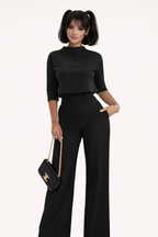 Black pantsuit set with crop top and wide legs, front view