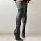 Black overknee boots worn with high heels side view