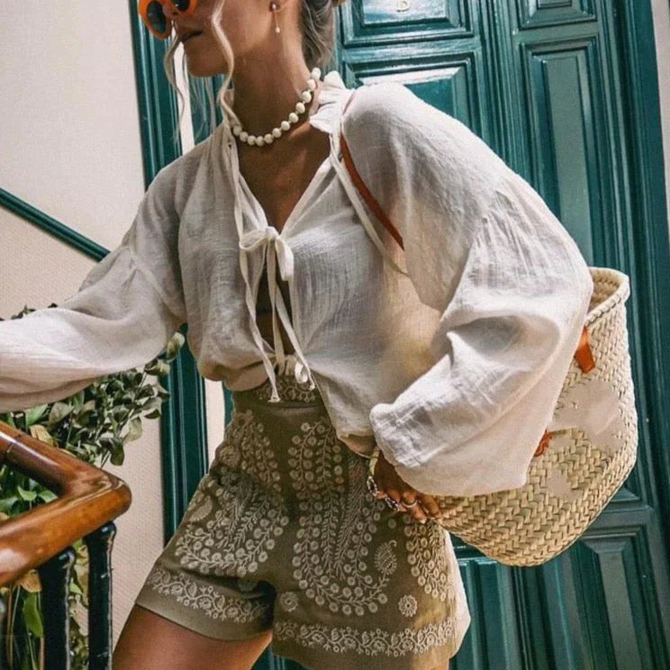 High-waist paisley shorts khaki side view with white blouse