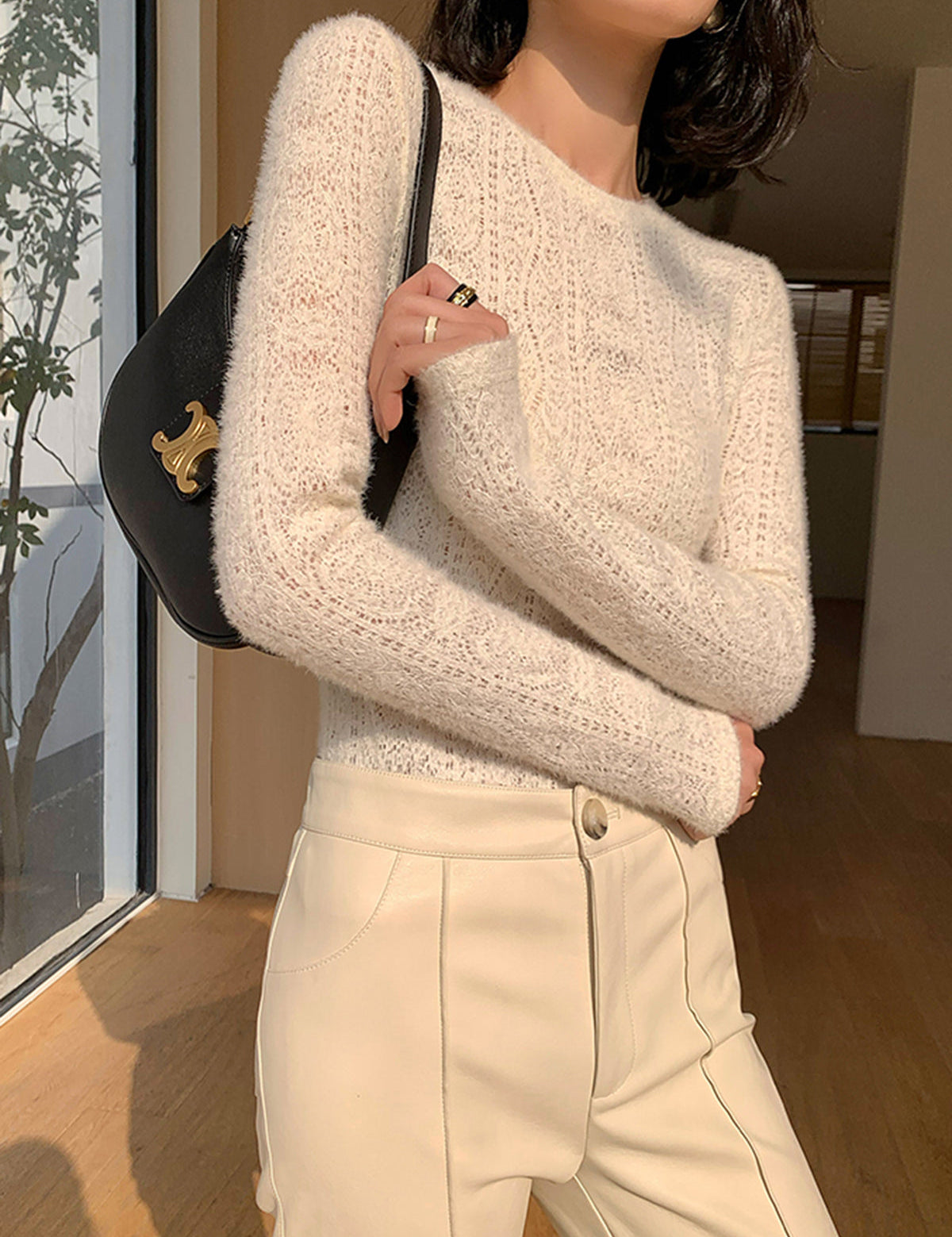 Cream knit top with openwork pattern side view