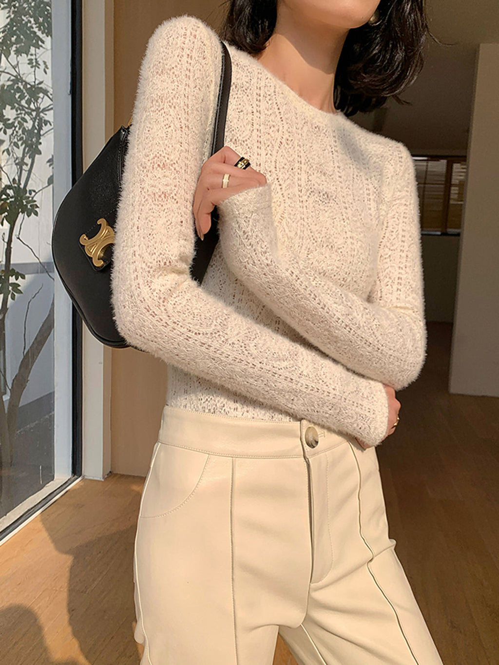 Cream knit top with openwork pattern side view