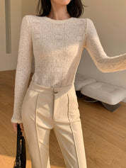 Cream knit top with openwork pattern three-quarter view