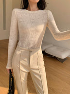Cream knit top with openwork pattern three-quarter view
