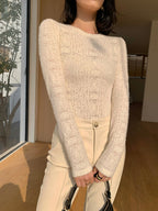 Cream knit top with openwork pattern side profile