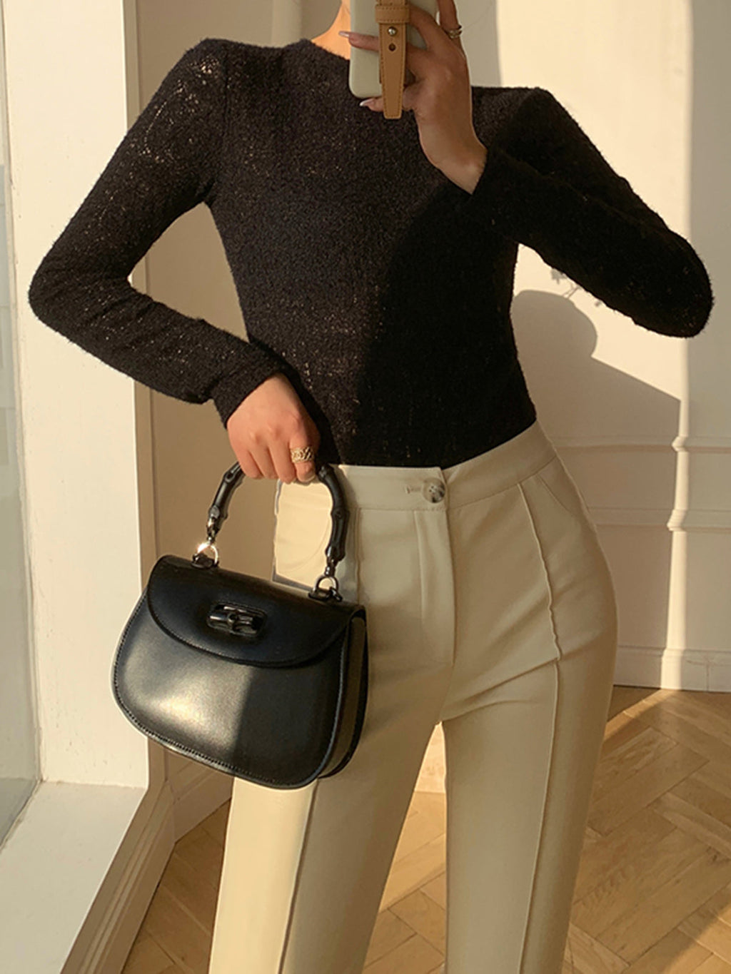 Black knit top with openwork pattern front view