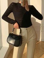 Black knit top with openwork pattern front view